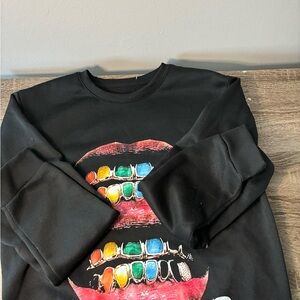 Black Sweatshirt with Vibrant Mouth Graphic